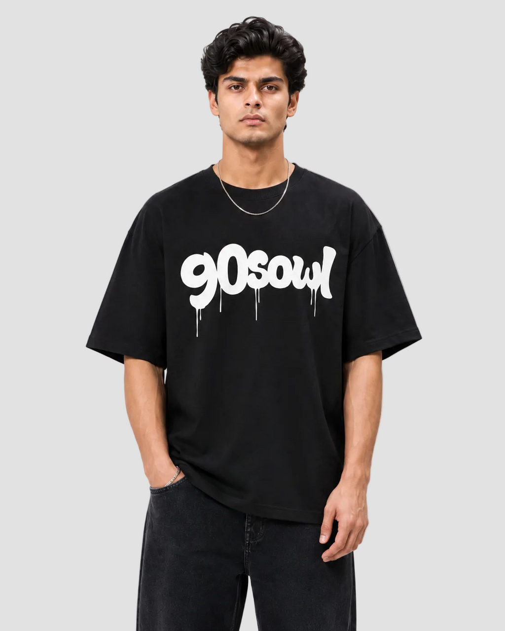 A man wearing a black t-shirt with a white '90soul' graphic, standing against a light gray background.