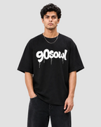 A man wearing a black t-shirt with a white '90soul' graphic, standing against a light gray background.