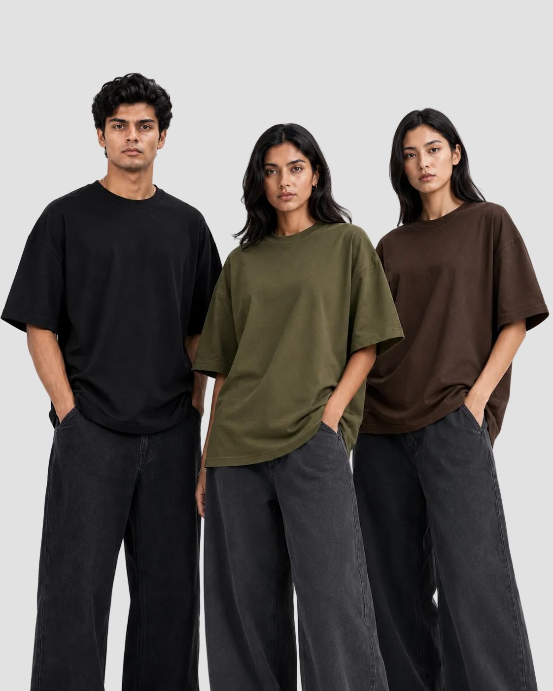 Three models wearing 90sOWL premium oversized crewneck t-shirts in black, olive green, and dark brown with wide-leg pants on a white studio background.